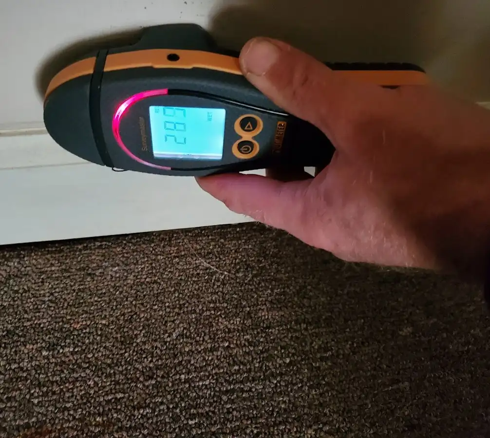 Moisture detection at baseboard during Storm Damage Restoration in Lafayette